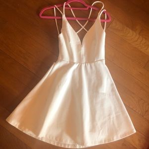 White strappy back peplum dress